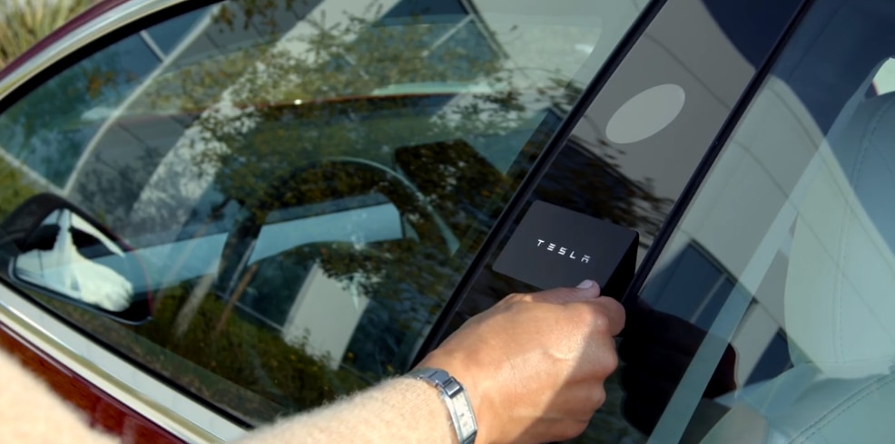 To use a Tesla Key Card, tap it on the b-pillar of the car, below the camera.