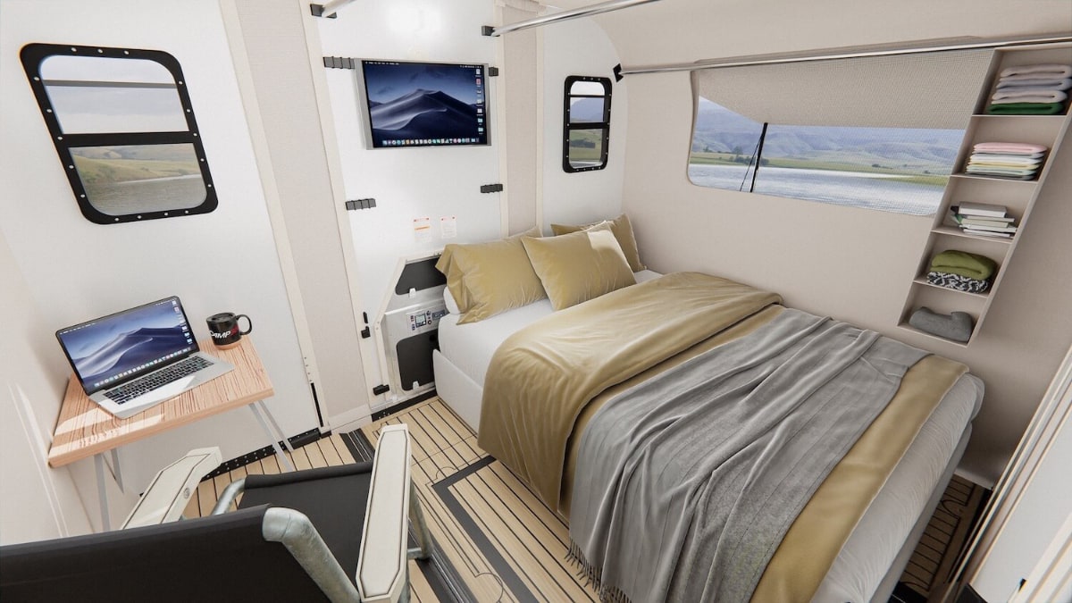 The camper includes a sleep and work area, as well as a place to cook