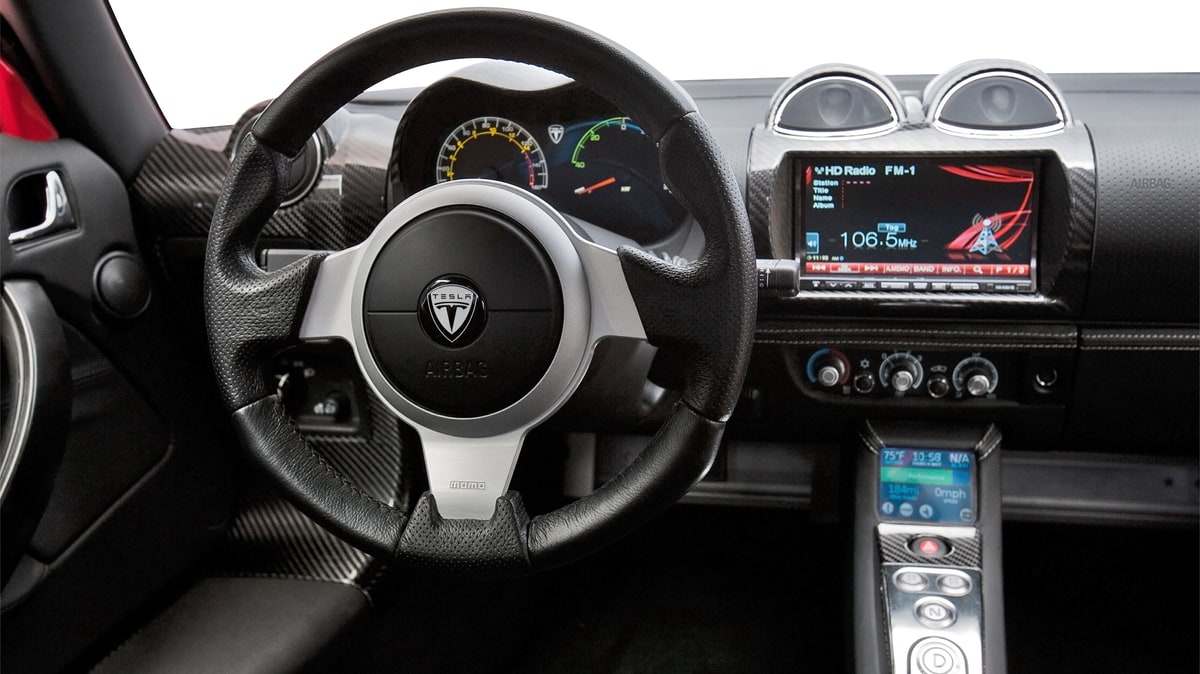 The interior of the original Roadster features two screens