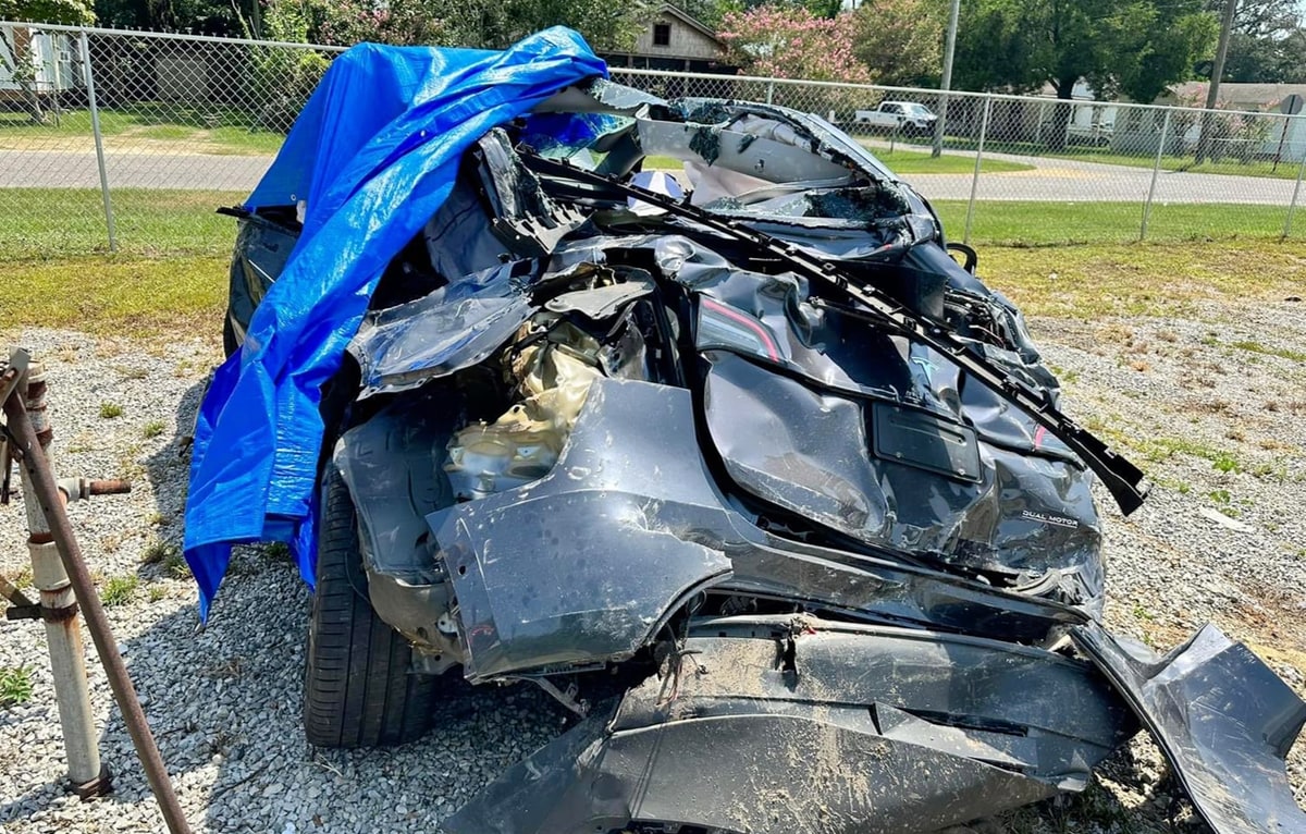 Driver survives after being side-swiped and pushed it into a tree by a truck